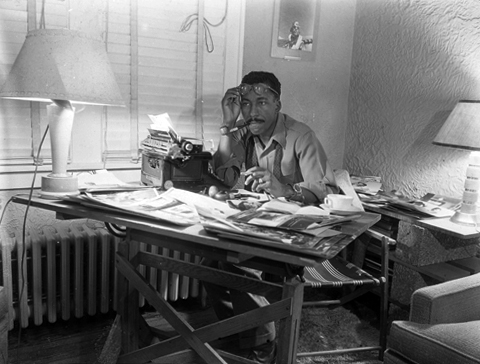 Parks at work at his desk, ca. 1946.